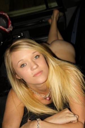 Blonde amateur Teagan slides lace panties aside to get naked inside a vehicle on clubgf.com