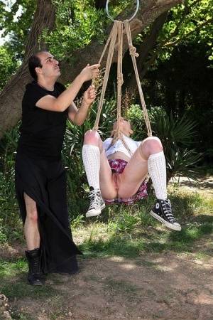 Schoolgirl Samantha Bentley finds herself suspended from ropes in the woods on clubgf.com