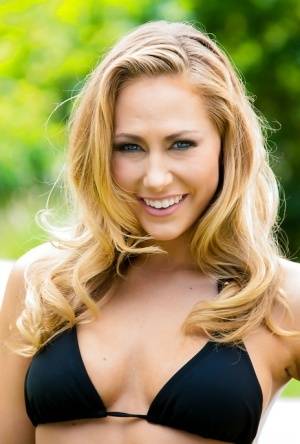 Exceptionally beautiful babe Carter Cruise lies on green grass on clubgf.com