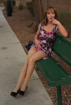 Aged lady flashes her tits and twat on a public bench before disrobing at home on clubgf.com