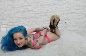 Tatted chick with blue hair is left hogtied in heels and her underwear on clubgf.com